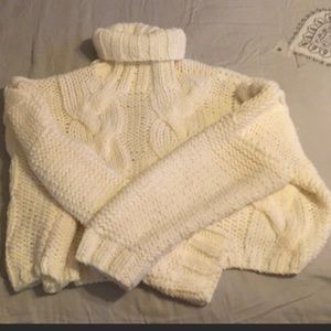 Cropped cable knit turtleneck sweater